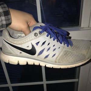 Gray and blue nike running shoes